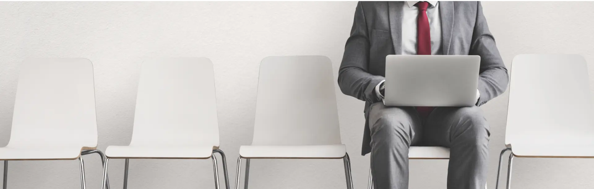 career opportunities at seven rings cement job applicant with laptop waiting for interview