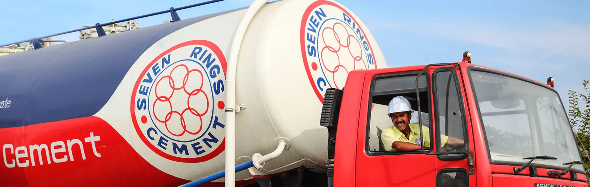 Seven Rings Cement truck driven by a worker, highlighting the road transport division's commitment to reliable delivery.